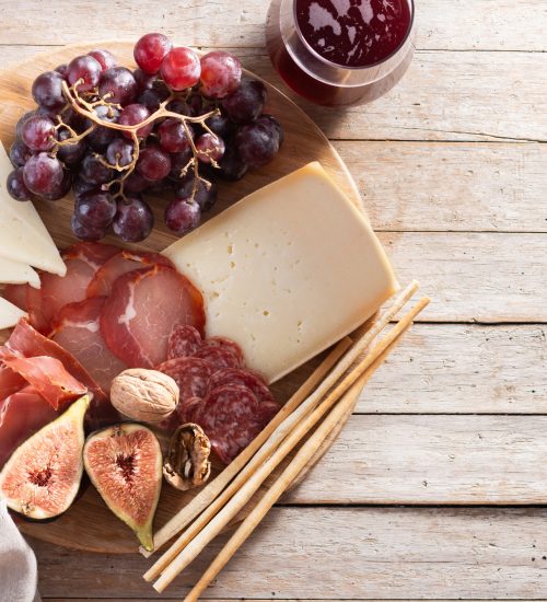 Charcuterie Board with Cheese, Grapes, and Figs